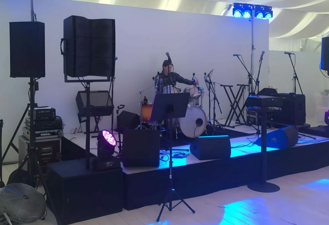 Technician tuning outdoor sound equipment