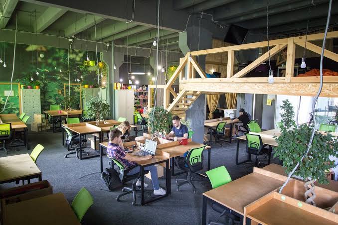 Professionals collaborating in a bright modern workspace