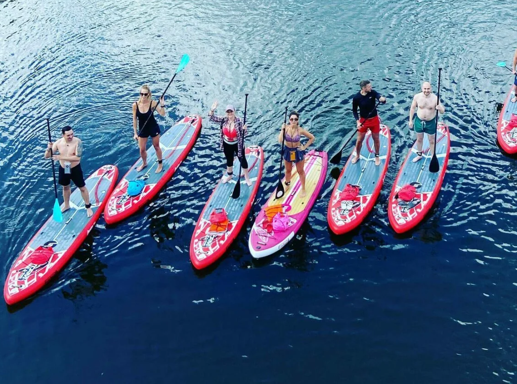 Waterfront team preparing paddle safari equipment near Nantes quay